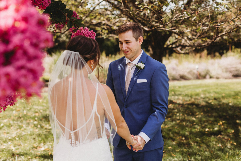 Touching first look between Christine and Michael, set against the backdrop of their intimate backyard wedding in Pennsylvania