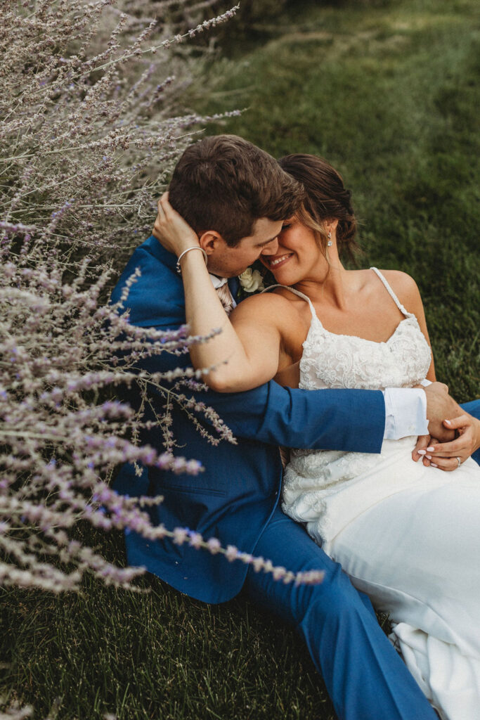 Christine and Michael smiling lovingly at each other in a lush Pennsylvania backyard, celebrating their wedding day