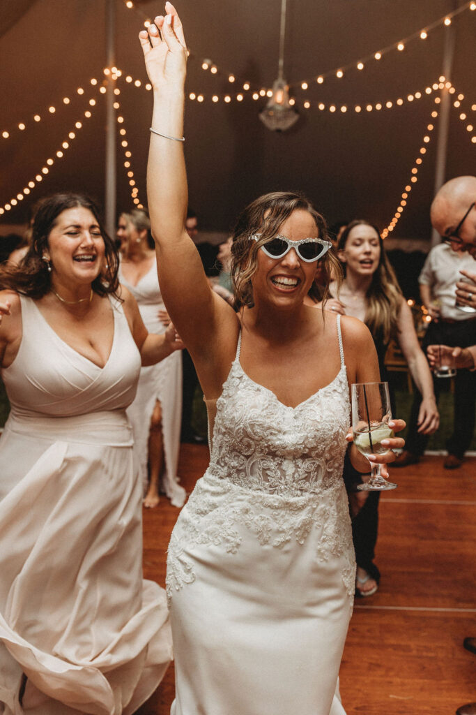 Bride and groom dancing, laughing and having fun during their backyard wedding reception in Pennsylvania