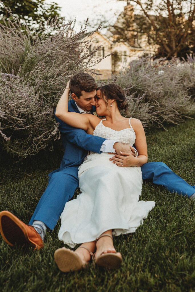 Newlyweds sharing a tender moment amidst the natural beauty of their backyard wedding in Pennsylvania