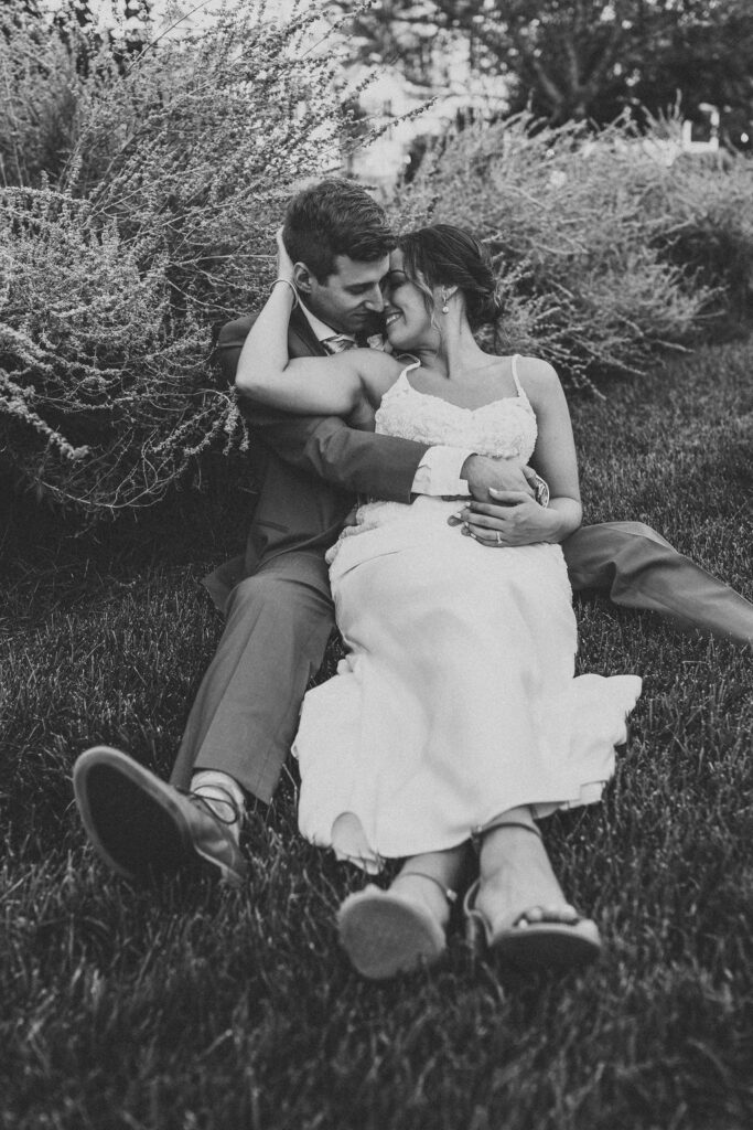 Newlyweds sharing a tender moment amidst the natural beauty of their backyard wedding in Pennsylvania