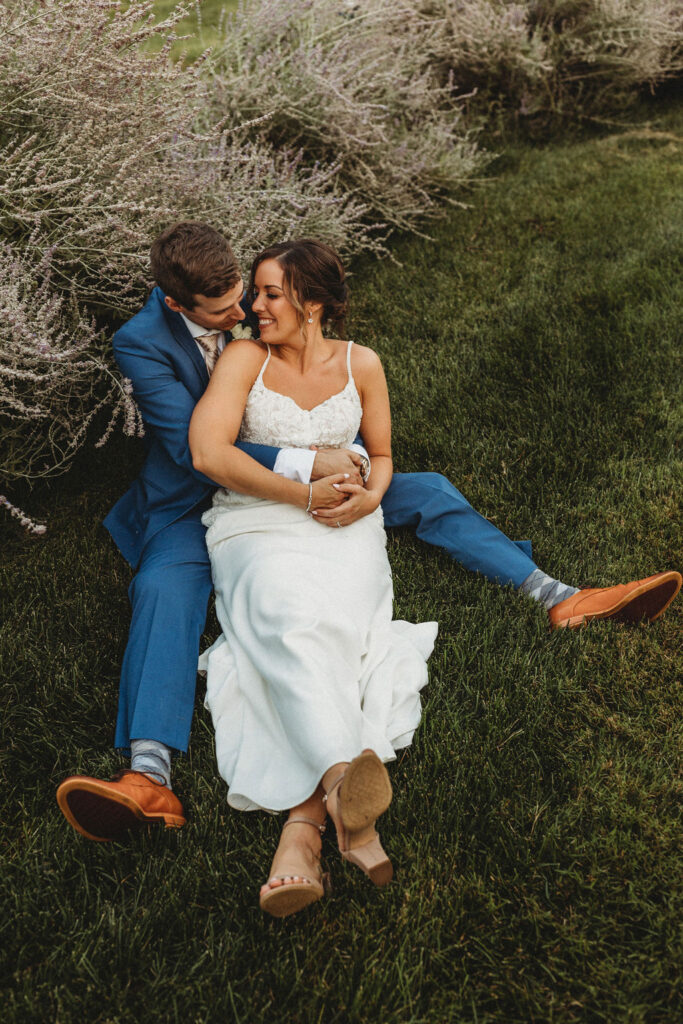 Newlyweds sharing a tender moment amidst the natural beauty of their backyard wedding in Pennsylvania