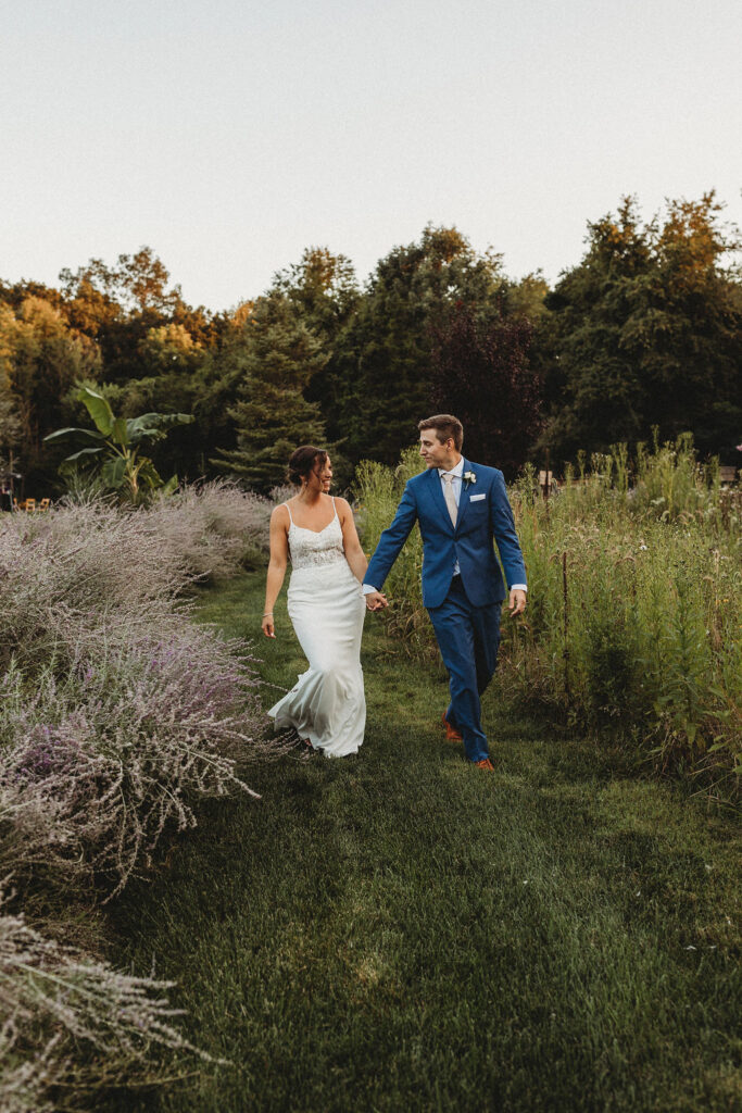 Newlyweds sharing a tender moment amidst the natural beauty of their backyard wedding in Pennsylvania