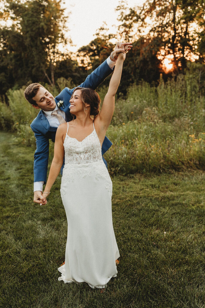 Christine and Michael smiling lovingly at each other in a lush Pennsylvania backyard, celebrating their wedding day