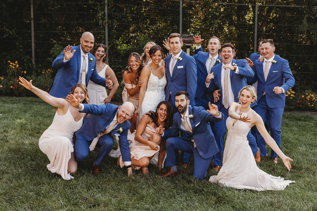 The couple and their wedding party captured in a spontaneous, joy-filled moment, radiating happiness at the backyard wedding in Pennsylvania