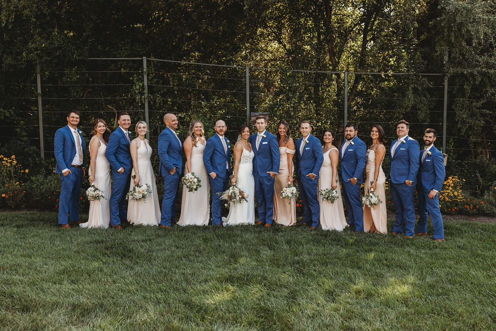 The couple and their wedding party captured in a spontaneous, joy-filled moment, radiating happiness at the backyard wedding in Pennsylvania