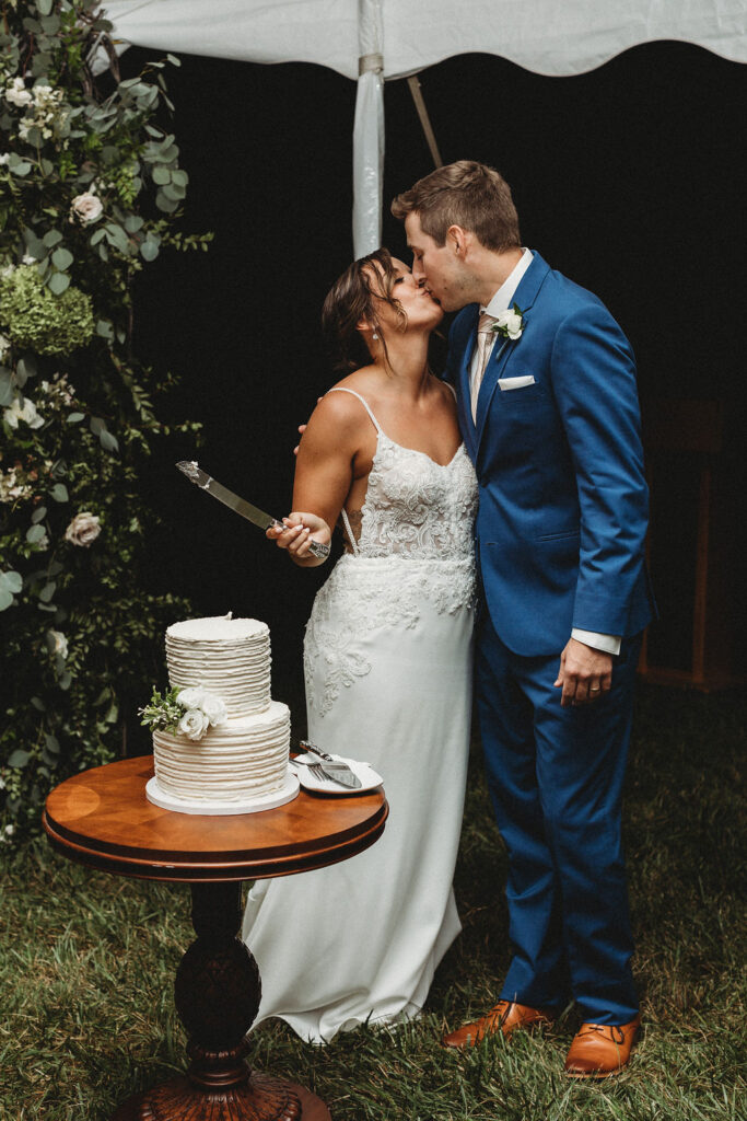 Bride and groom cutting cake