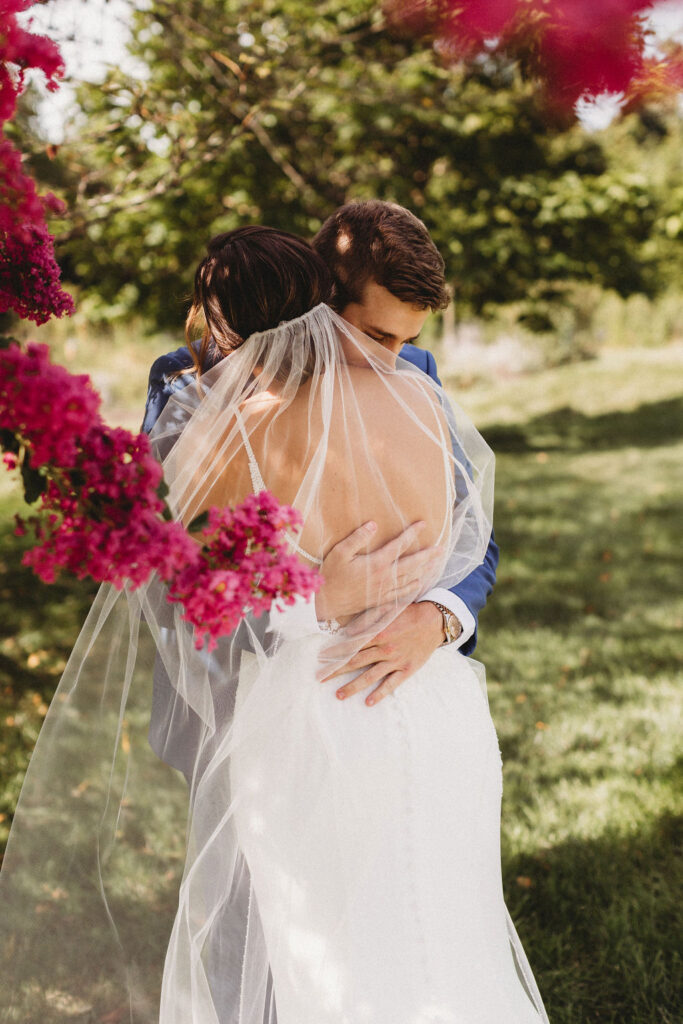 Touching first look between Christine and Michael, set against the backdrop of their intimate backyard wedding in Pennsylvania