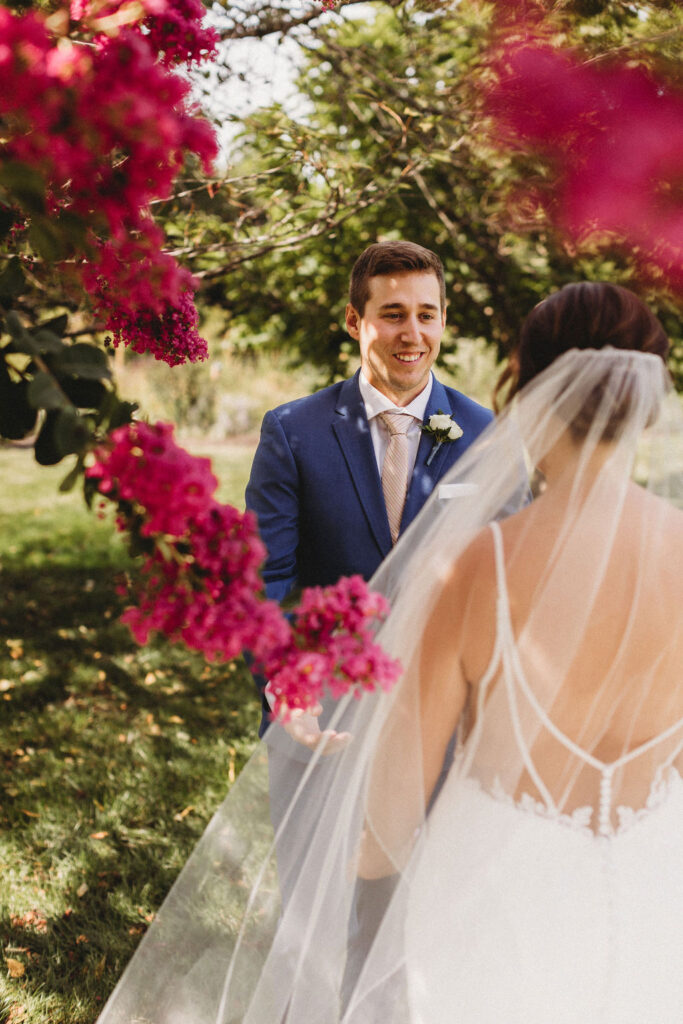 Touching first look between Christine and Michael, set against the backdrop of their intimate backyard wedding in Pennsylvania