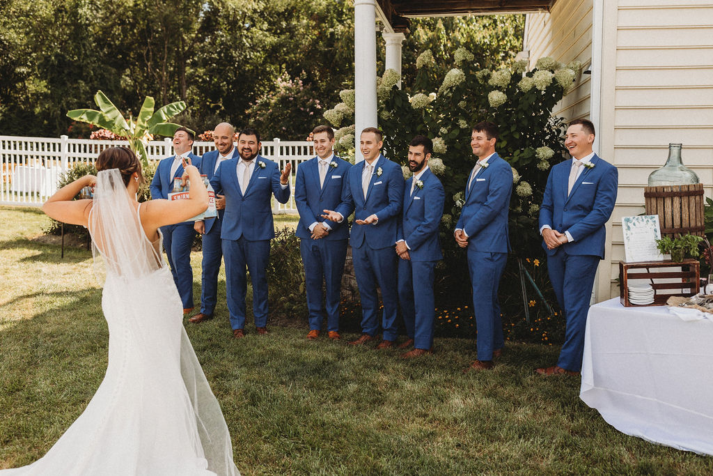 Wedding party's excited reactions as they see the bride for the first time on the wedding day