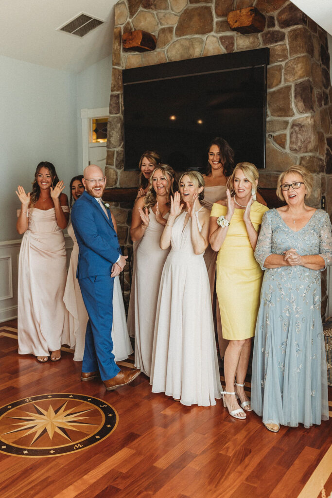 Wedding party's excited reactions as they see the bride for the first time on the wedding day