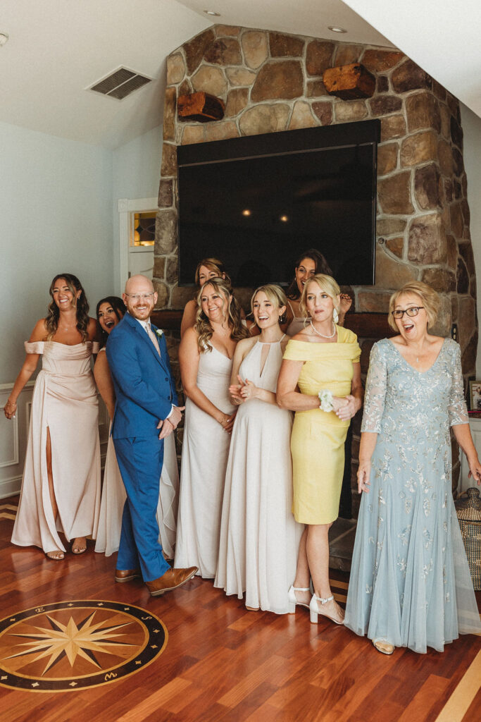 Wedding party's excited reactions as they see the bride for the first time on the wedding day