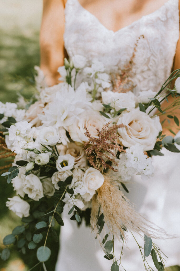 Close-up of the vibrant and delicately arranged wedding florals at Christine and Michael’s Pennsylvania backyard celebration.