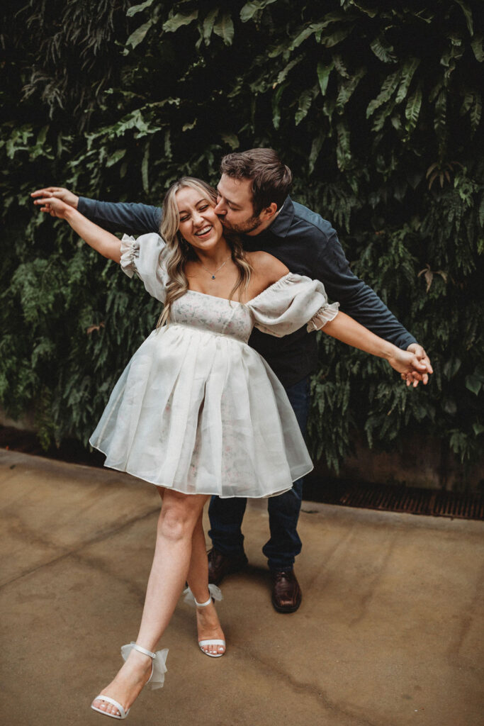 romantic couple cuddling during their longwood gardens engagement session