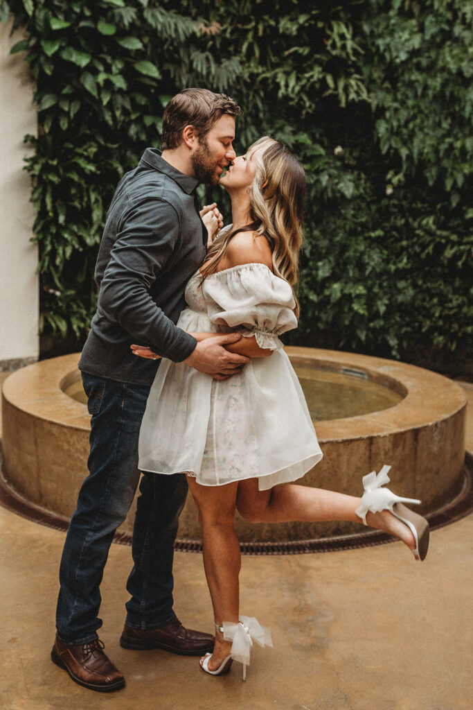 romantic couple cuddling during their longwood gardens engagement session