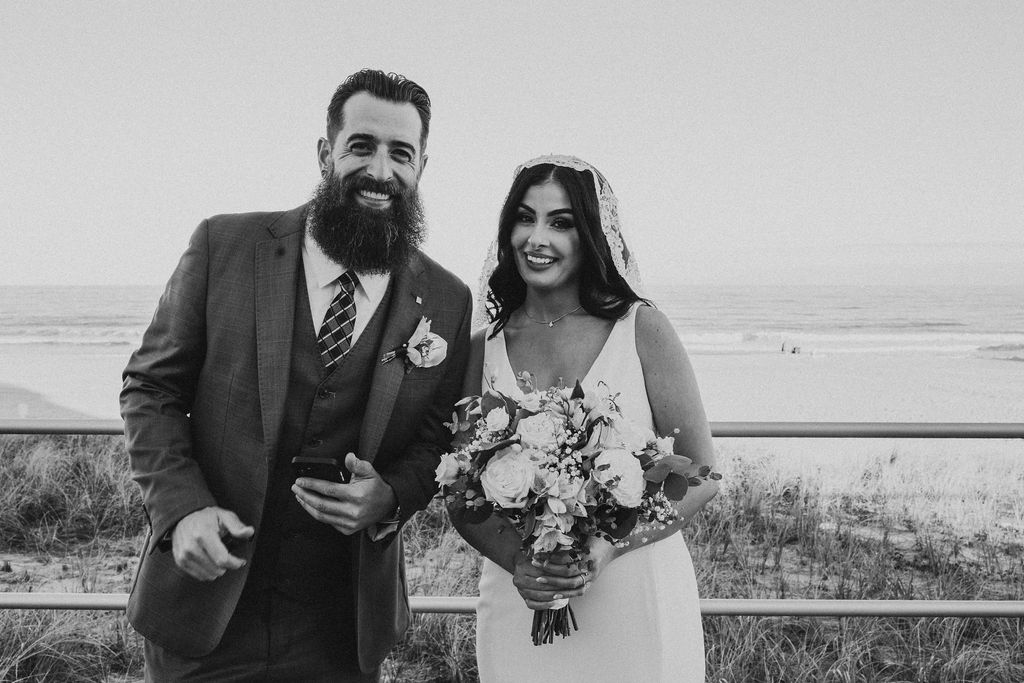 romantic bride and groom posting at the beach during their hawaii elopement