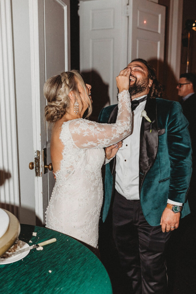 bride and groom cutting cake