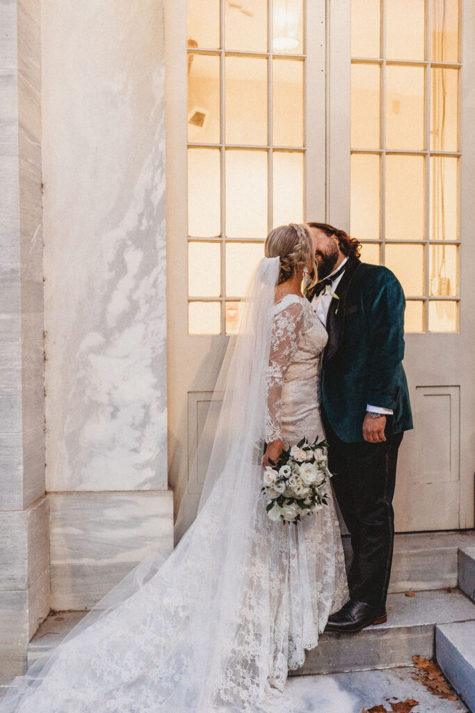 candid bride and groom walking around and snapping pics in downtown philadelphia