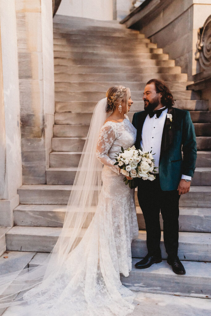 candid bride and groom walking around and snapping pics in downtown philadelphia