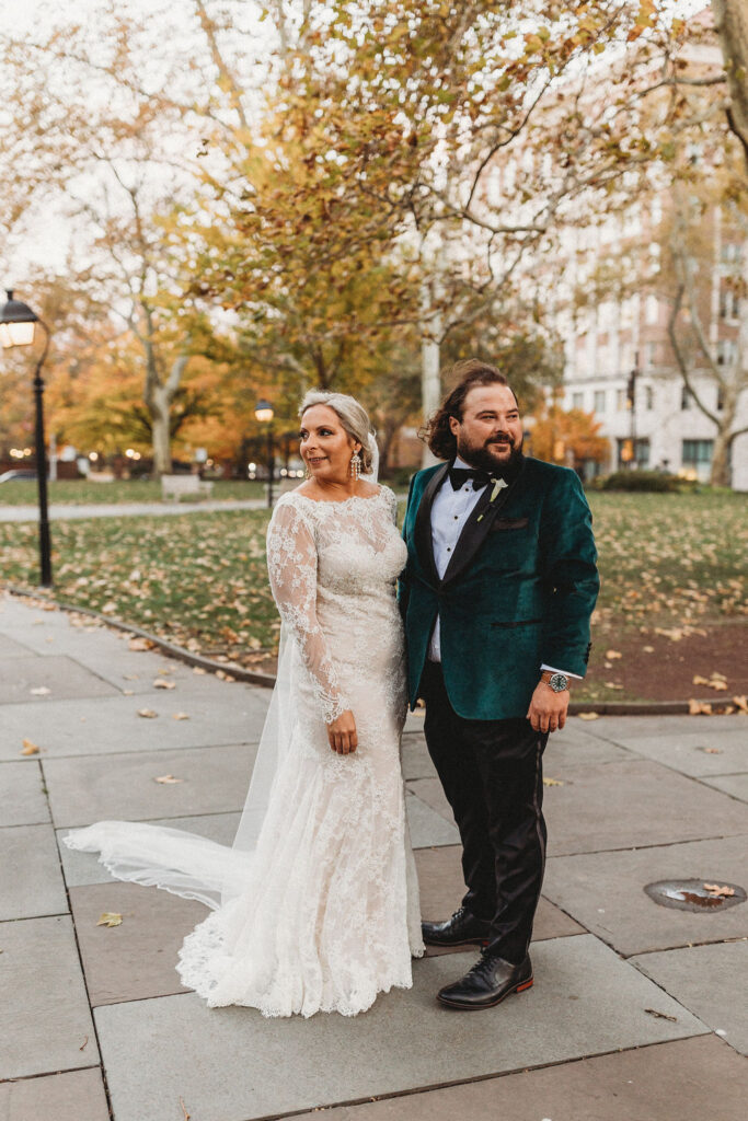 candid bride and groom walking around and snapping pics in downtown philadelphia