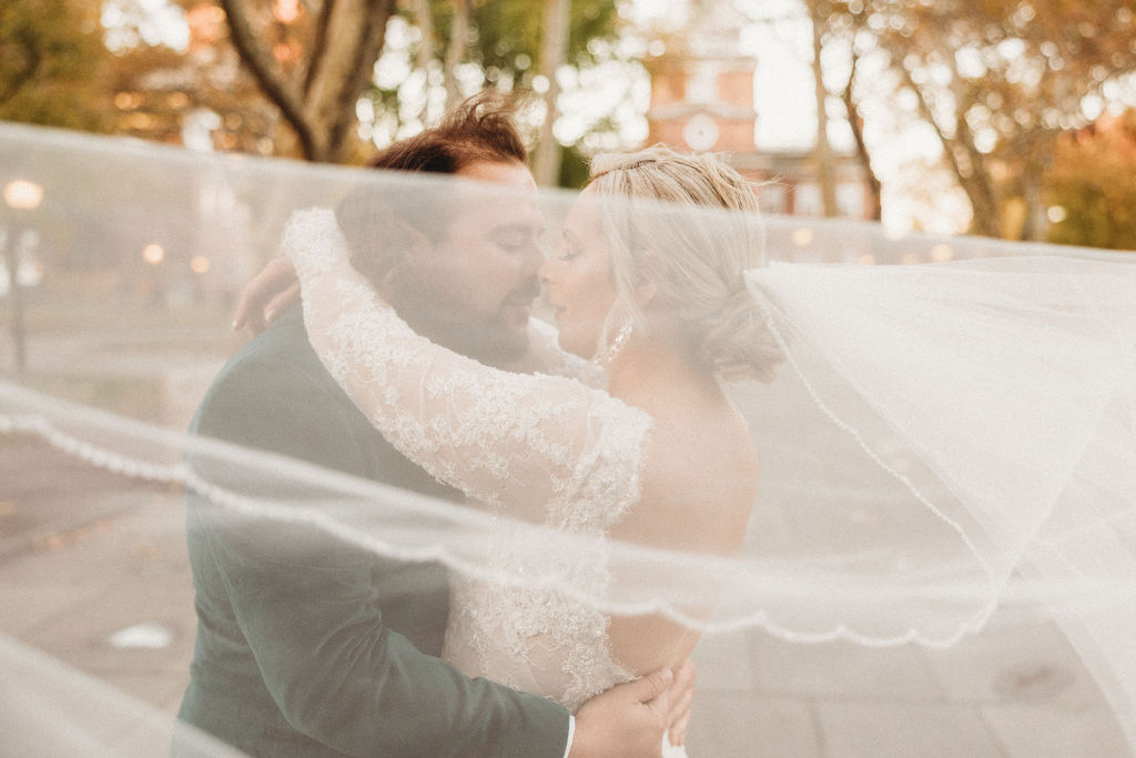 candid bride and groom walking around and snapping pics in downtown philadelphia