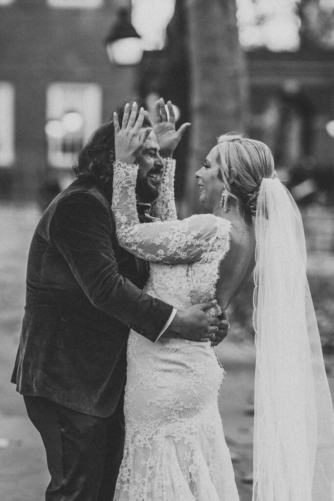 candid bride and groom walking around and snapping pics in downtown philadelphia