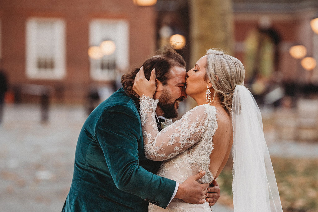 candid bride and groom walking around and snapping pics in downtown philadelphia