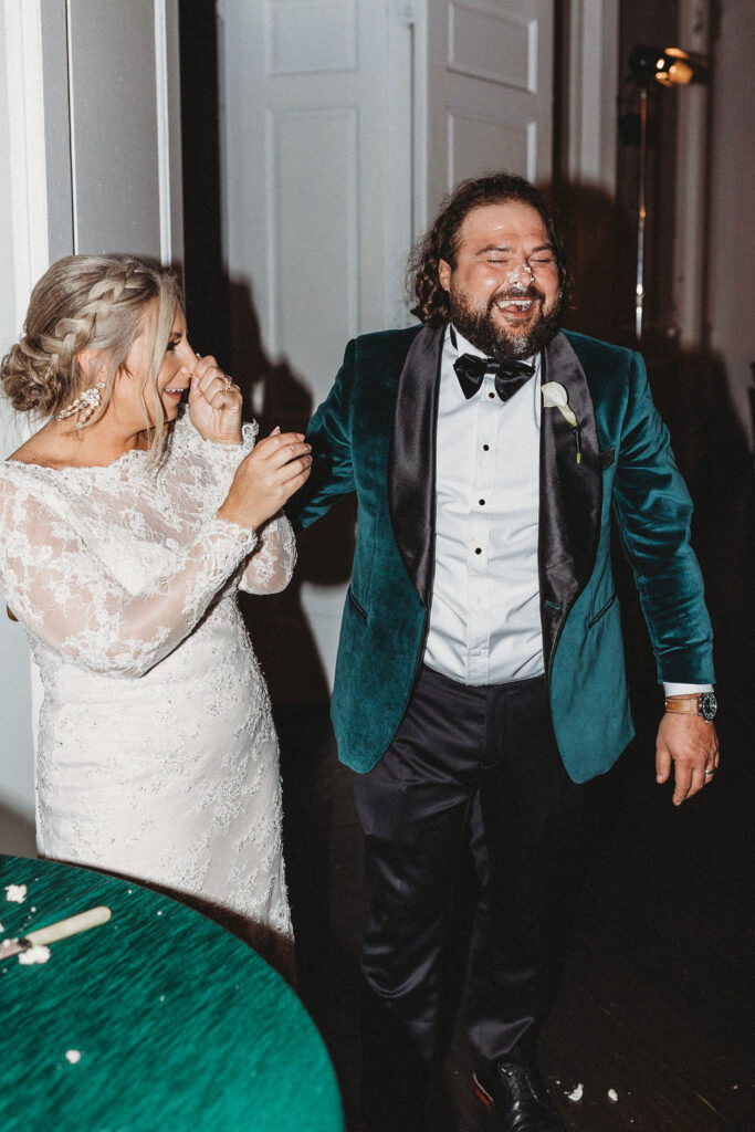 bride and groom cutting cake