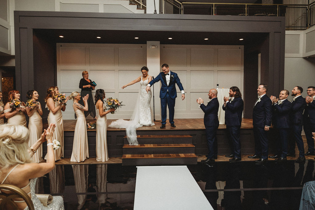 bride and groom leaving the ceremony at the lucy by cescaphe