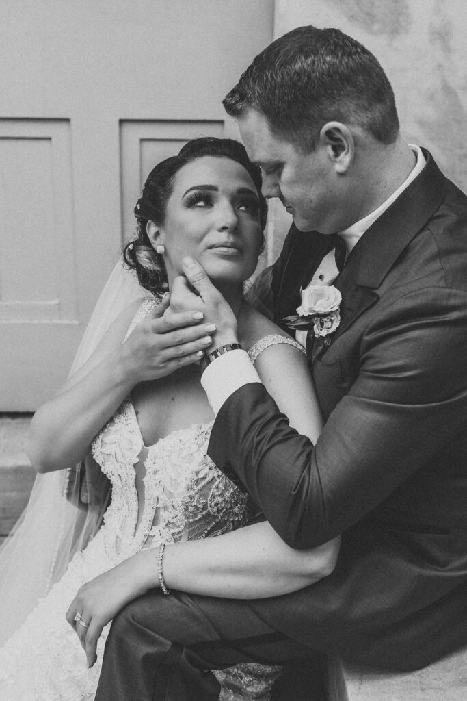 bride and groom posing at the Merchants exchange building in philadelphia