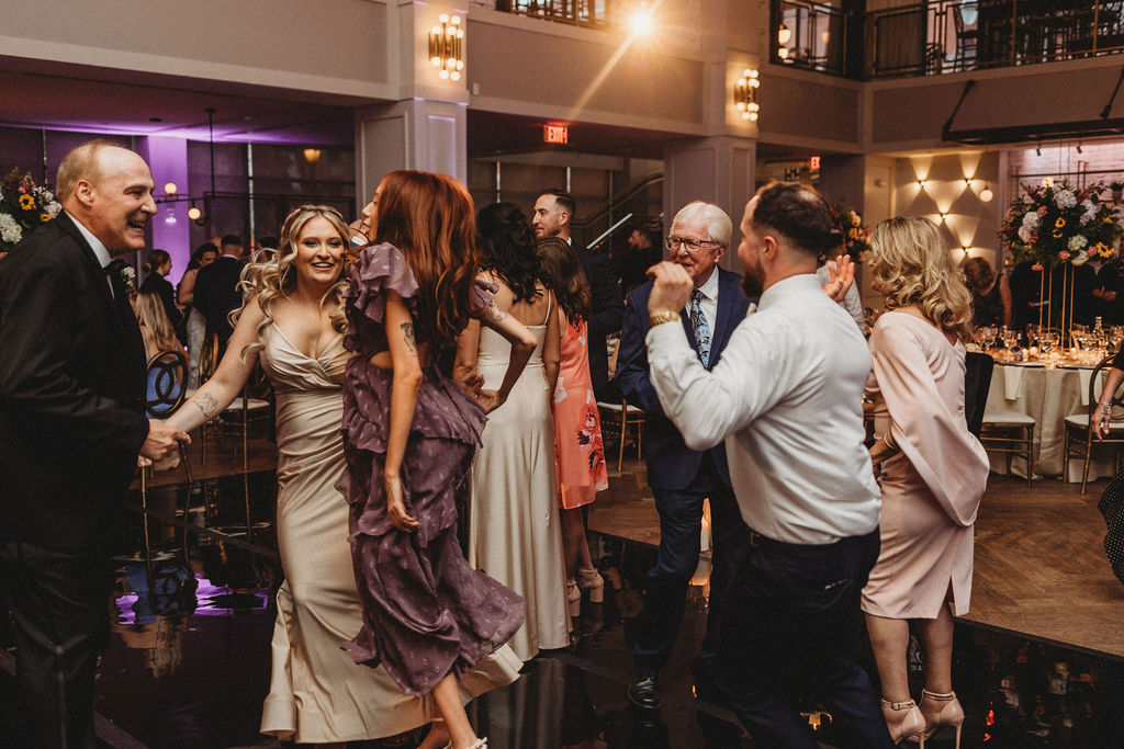 guests dancing during the reception at the lucy by cescaphe