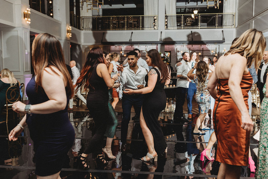 guests dancing during the reception at the lucy by cescaphe