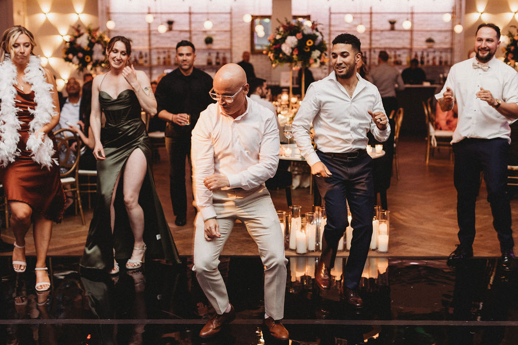 guests dancing during the reception at the lucy by cescaphe