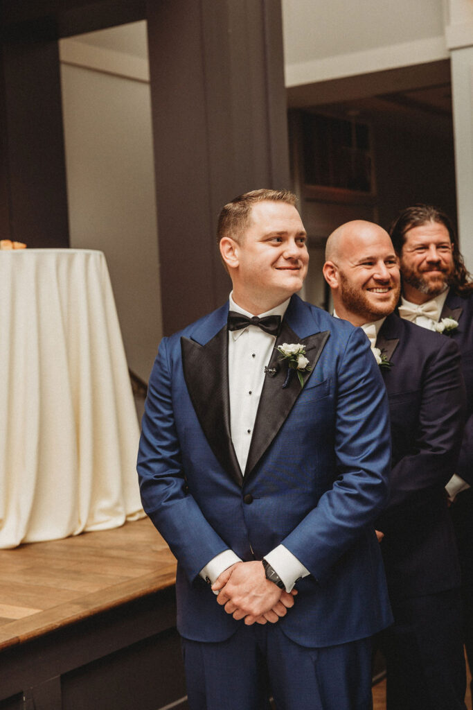 groom waiting at the altar