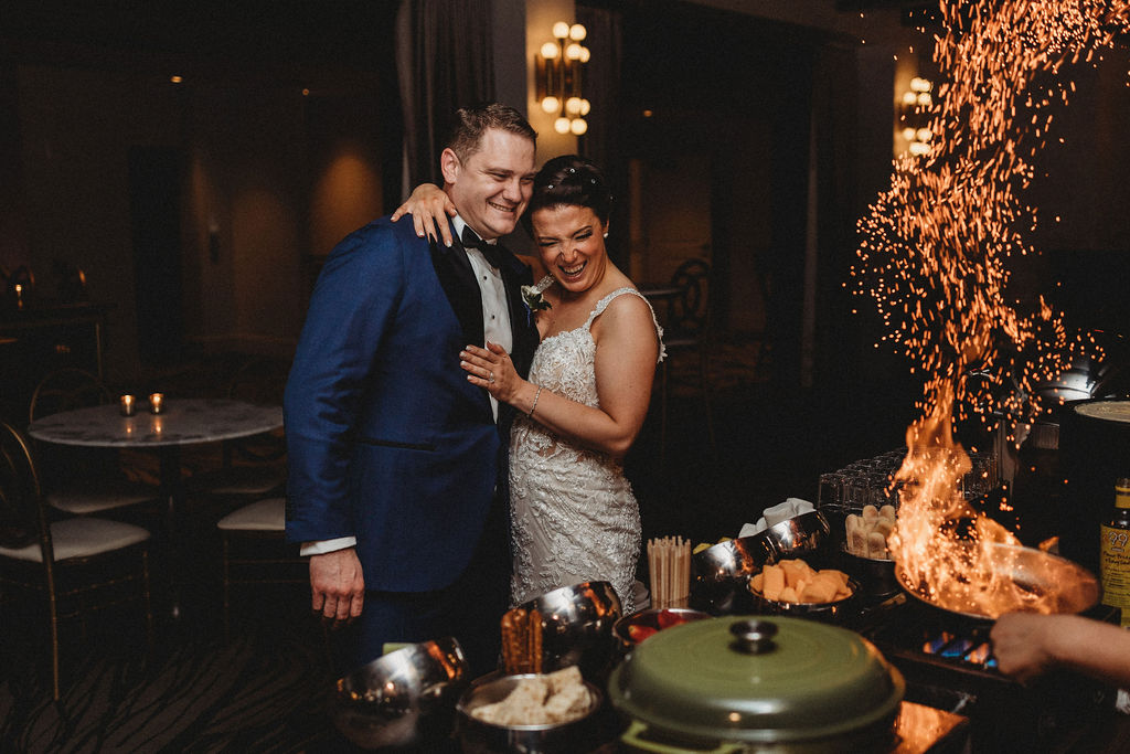 bride and groom enjoying the wedding food at the lucy by cescaphe