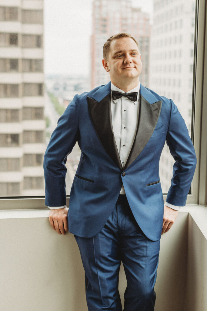 groom getting ready in a hotel room