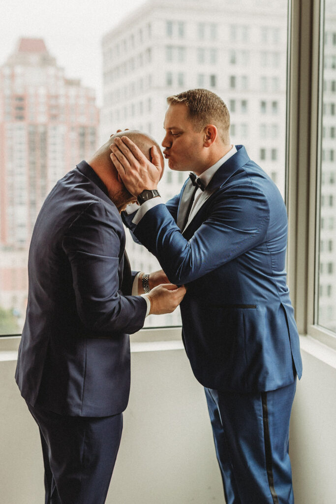 groom getting ready in a hotel room