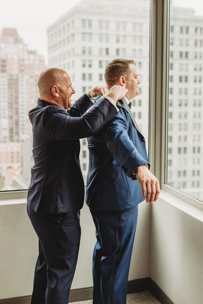 groom getting ready in a hotel room