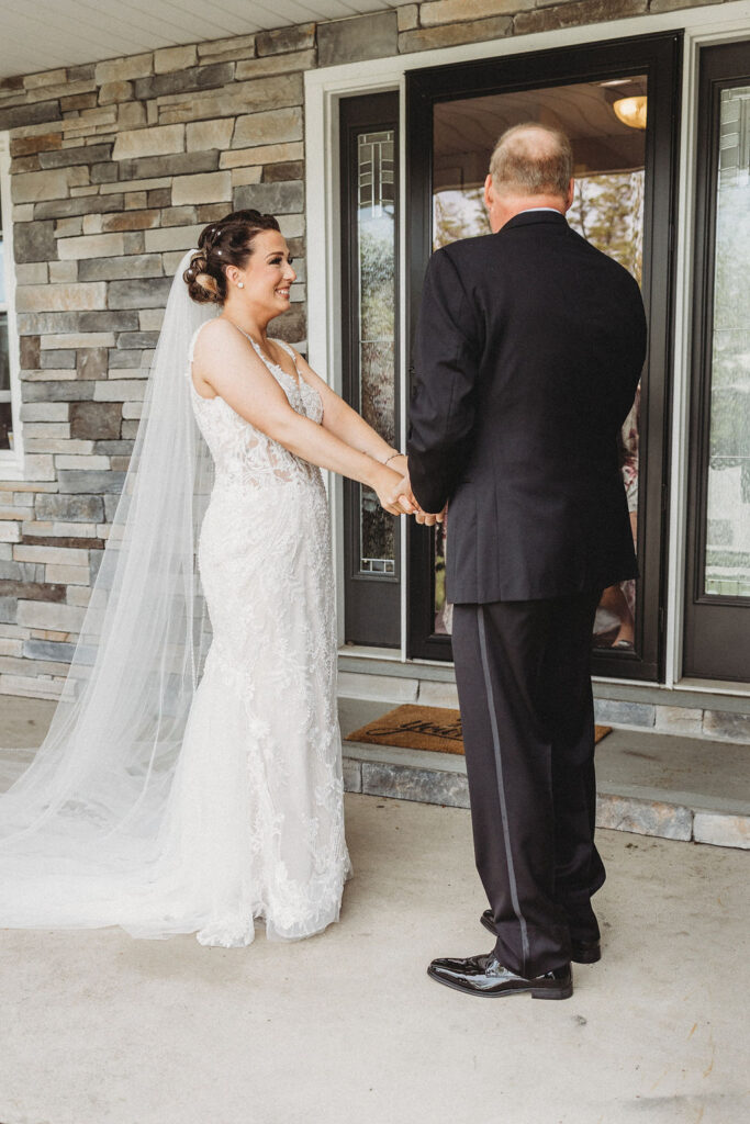 bride and dad emotional first look 