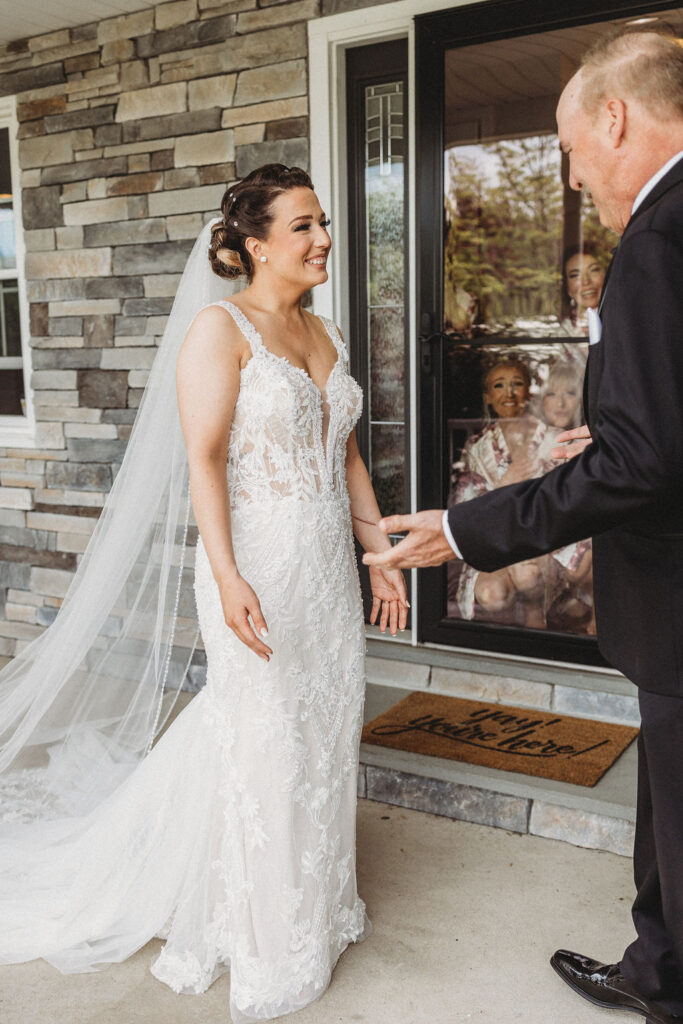 bride and dad emotional first look 