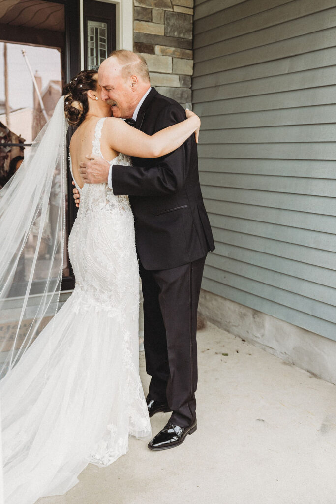 bride and dad emotional first look 