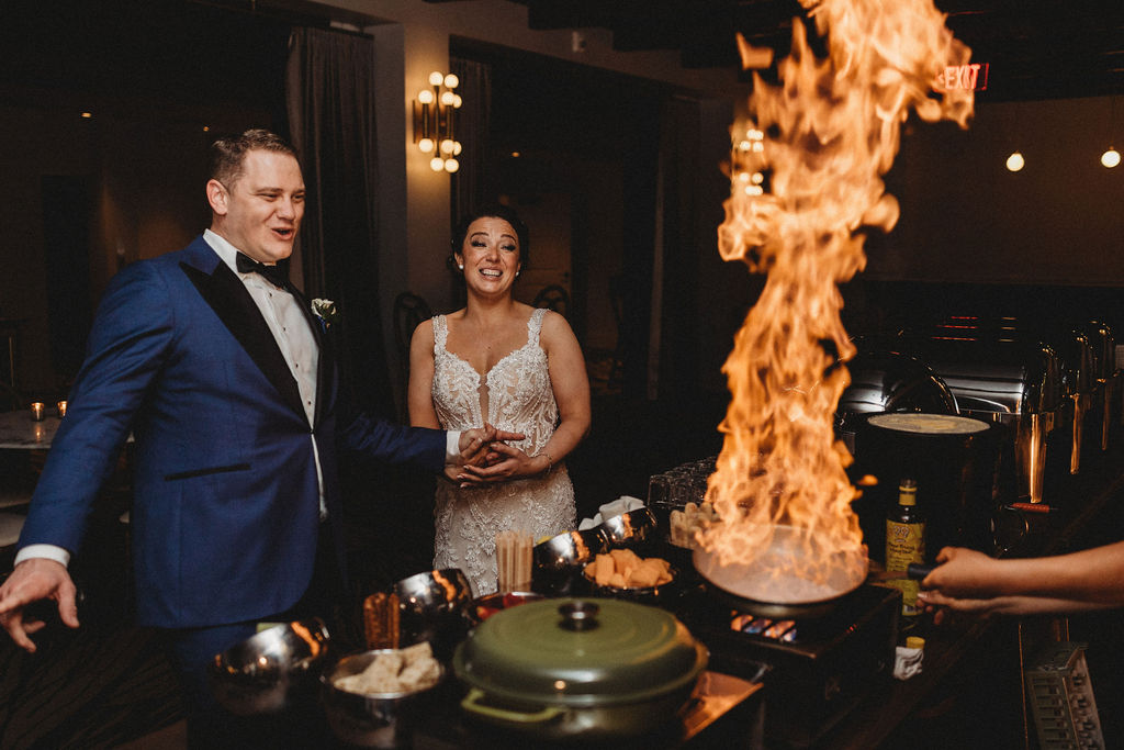 bride and groom enjoying the wedding food at the lucy by cescaphe